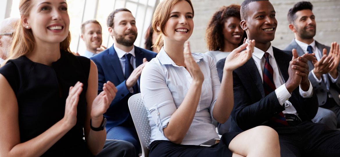 Audience-applauding-at-business-conference