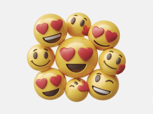 Vielzahl von Emoji, darunter lachelnde Gesichter mit Herzen als Augen und ein kussendes Gesicht kuss smiley skrivanek